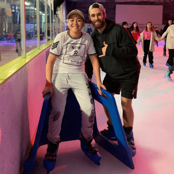 Man and boy ice skating