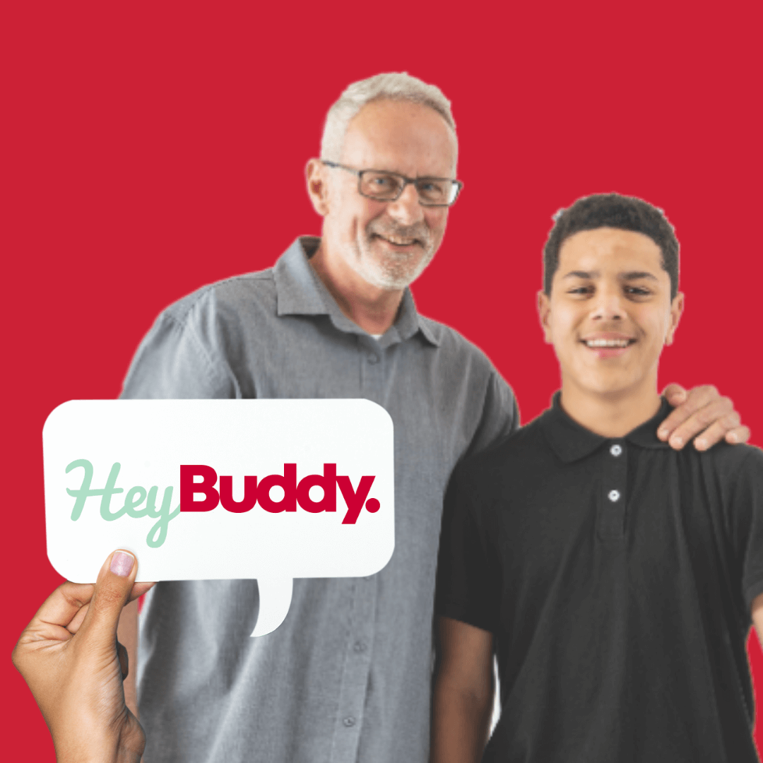 Man standing with a boy with his hand on his shoulder. Both looking happy and friendly. Logo says Hey Buddy