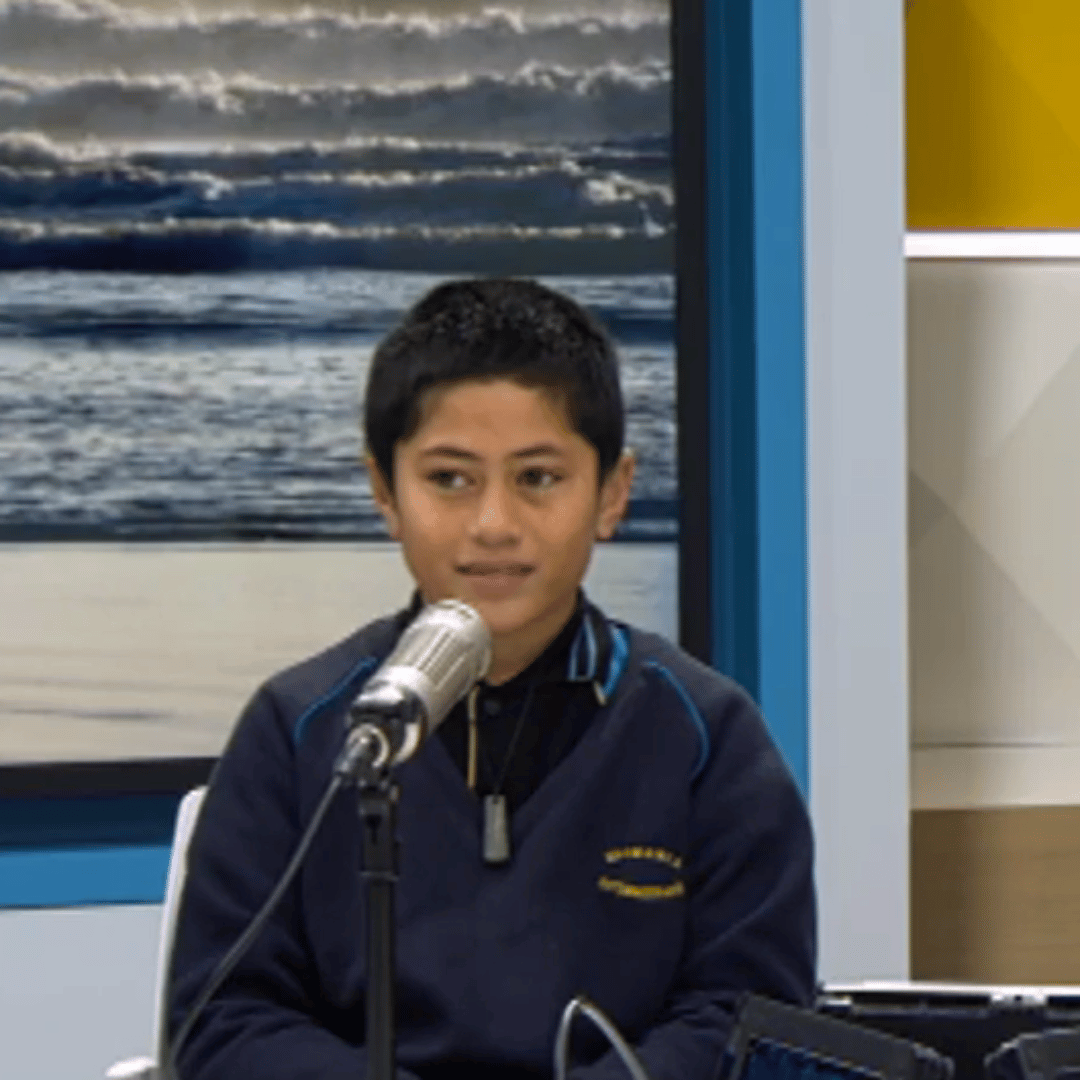 Boy talking into a microphone