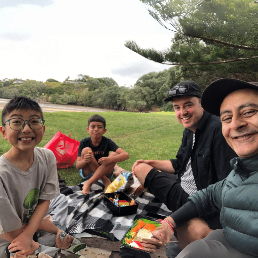 2 men and 2 boys having a picnic. Big Buddy