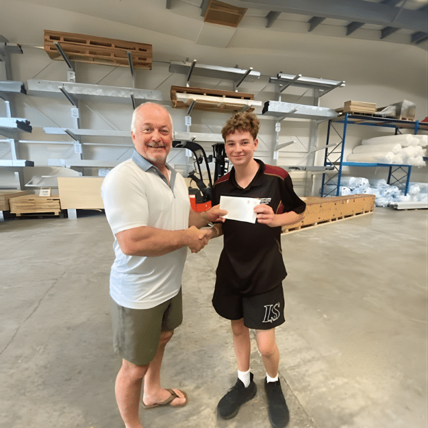 Tim handing over Alex's first paycheck