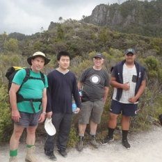 young men reach for pinnacles